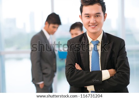 Portrait of a handsome guy being successful in business