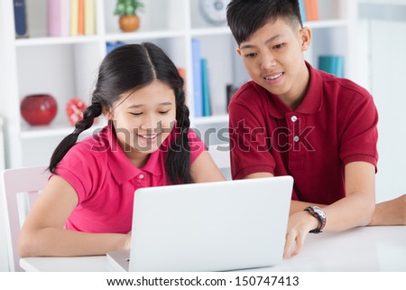 Close-up image of juniors at the lesson of computer studies