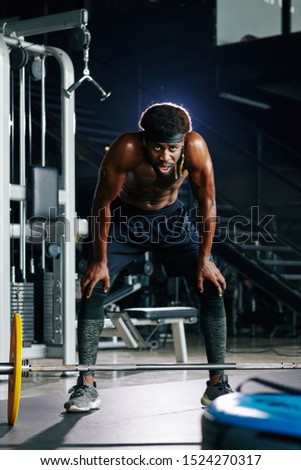 Similar – Image, Stock Photo Strong ethnic sportsman breathing during training on sports ground