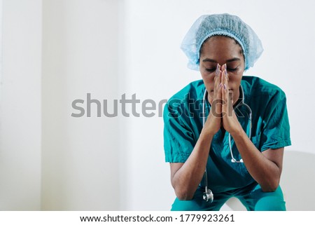 Similar – Image, Stock Photo Sad, exhausted doctor sitting in a dark room