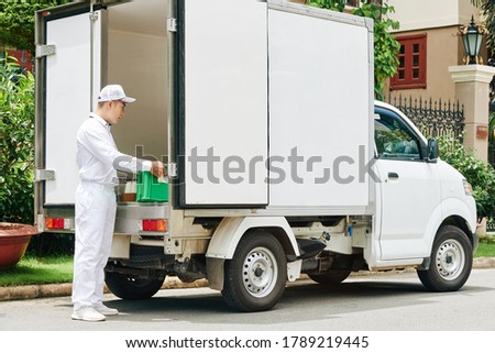 Similar – Image, Stock Photo Man taking milk box from the fridge