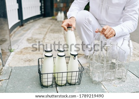 Similar – Image, Stock Photo Man taking milk box from the fridge