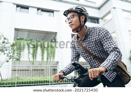 Similar – Image, Stock Photo healthy man riding a bicycle on a mountain road in a sunny day