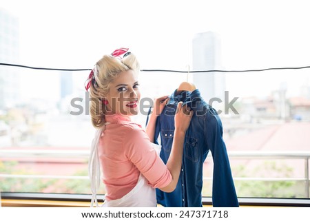Gorgeous retro housewife hanging denim jacket