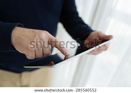 Man surfing the net on touch pad