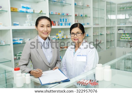 Asian business woman sighing contract with pharmacist