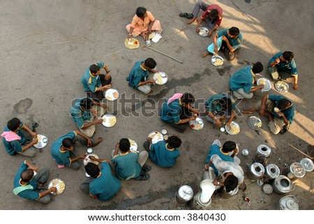 Working Staff of an Indian Train Eating during a break on a Train Station