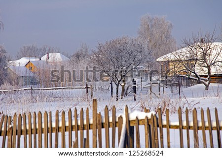 Cloudy winter day in the Russian village