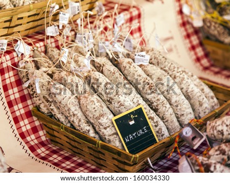 Sausage in a basket on the counter of a shop