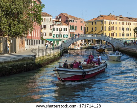 Venice, Italy . June 22, 2012 . Cargo boats carry about products on the canals of Venice