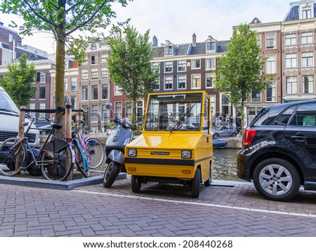 Amsterdam, Netherlands, on July 7, 2014. The cars parked on the bank of the channel
