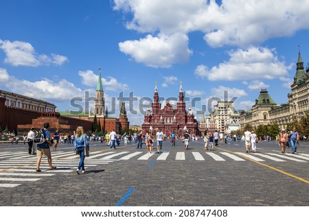 Moscow, Russia, on July 26, 2014. Tourists and citizens walk on Red Square in the sunny summer day. The Red Square is a main square of the city