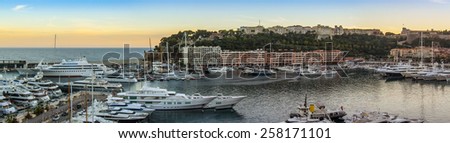 Principality of Monaco, France, on October 16, 2012. A view of the port and residential areas on a slope of mountains at sunset