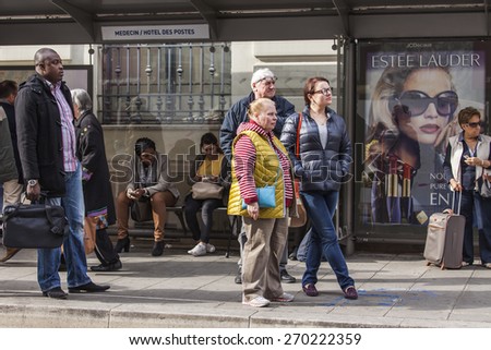 Nice, France, on March 7, 2015. Passengers expect the bus at a stop on Ru de La Post Street