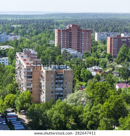 PUSHKINO, RUSSIA - on MAY 26, 2015. New multistoried houses on the river bank of Serebryank
