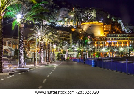 NICE, FRANCE, on MARCH 13, 2015. An English promenade (Promenade des Anglais) in evening Belland\'s tower (Tour Bellanda). Promenade des Anglais - one of the most beautiful embankments in Europe