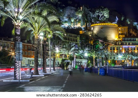 NICE, FRANCE, on MARCH 13, 2015. An English promenade (Promenade des Anglais) in evening. Belland\'s tower (Tour Bellanda). Promenade des Anglais - one of the most beautiful embankments in Europe