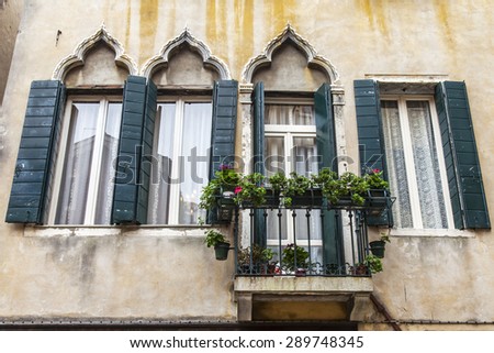 VENICE, ITALY - on APRIL 29, 2015. An architectural fragment of the ancient building on the canal embankment. A typical window in the Venetian style