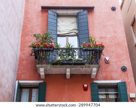 VENICE, ITALY - on MAY 1, 2015. An architectural fragment of the authentic old  building on the canal embankment.