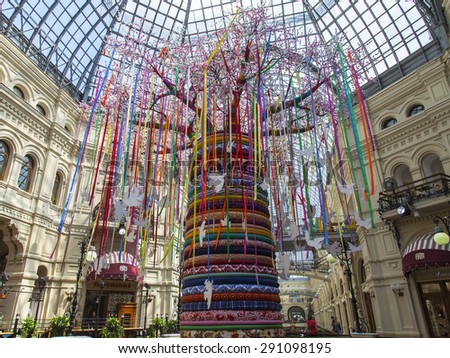 MOSCOW, RUSSIA, on JUNE 24, 2015. An interior of a trading floor of the GUM historical shop during summer sales. Summer installation in the central part of shop