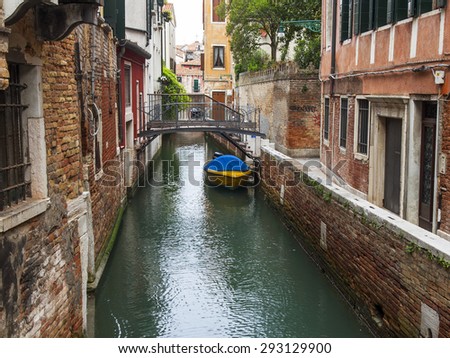 VENICE, ITALY - on MAY 3, 2015. Typical street canal. Architectural complex of old houses