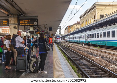 BOLOGNA, ITALY, on MAY 2, 2015. Passengers expect arrival of the train on the platform of the Central station
