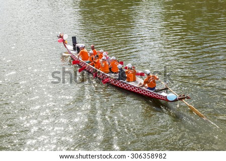 PUSHKINO, RUSSIA - on AUGUST 15, 2015. The team of oarsmen trains before a water holiday on Serebryank\'s river