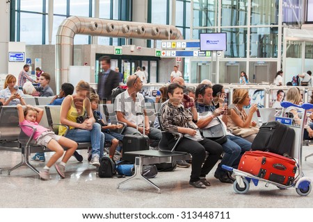 ROME, ITALY, on AUGUST 25, 2015. Fyumichino\'s airport, hall of departures. Passengers expect the announcement of the beginning a boarding in the plane