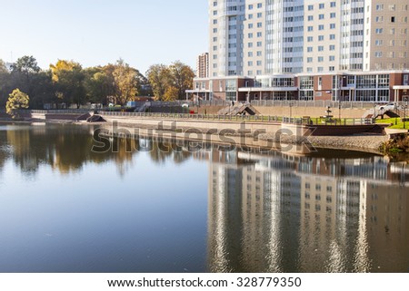 PUSHKINO, RUSSIA - on OCTOBER 16, 2015. Autumn landscape. New multystoried houses on the river bank of Serebryanka