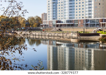PUSHKINO, RUSSIA - on OCTOBER 16, 2015. Autumn landscape. New multystoried houses on the river bank of Serebryanka