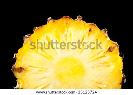 pineapple slice on black background