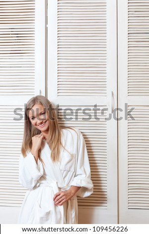 woman in spa salon near white cabinet