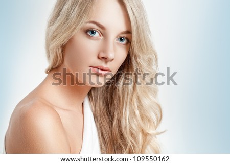 beautiful blonde woman closeup face portrait, copy space for text