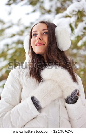 brunette woman walking in winter park, bottom point of view