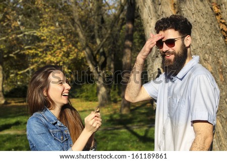 couple, male and female flirt and smile