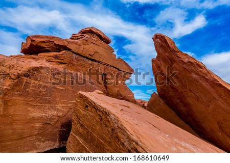 Interesting Wind Sculpted Red Sandstone Rocks in New Mexico with Blue Sky and White Clouds