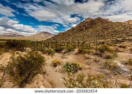 West Texas Landscape of Desert Area with Hills and Blue Sky with Clouds.