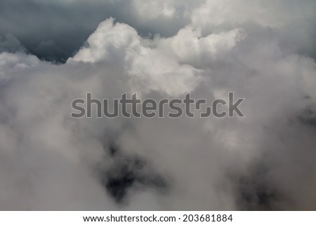 Dark Large Puffy Storm Clouds From Aerial View in the Sky.  Storm cloud background.