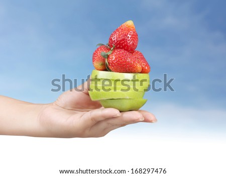 Woman hand with fruits ,holding mixed fruit