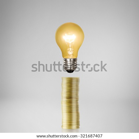 Bulb With Stack Of a Coins
