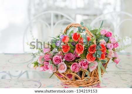 Artificial roses in the basket