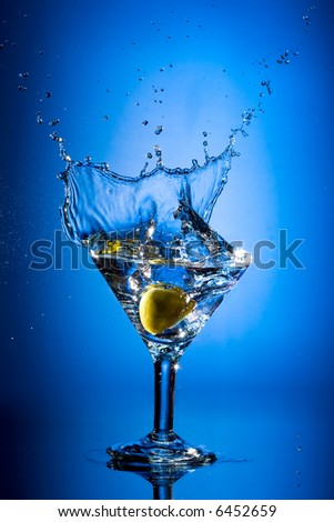 Close up view of the splash martini on blue