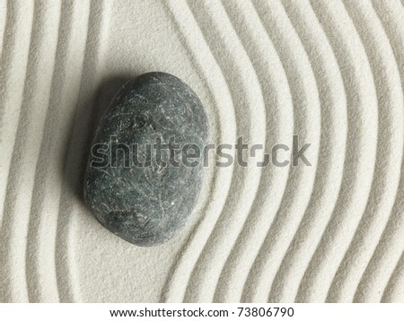 Zen stone in the sand. Background
