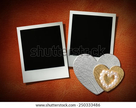 polaroid style photo frames on corkboard with paper heart