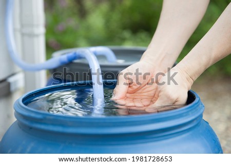 Similar – Foto Bild Wasserschlauch auf einer Baustelle entleeren.