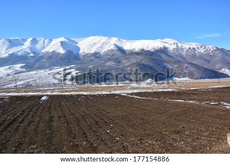 Winter landscape with agriculture field
