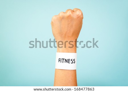 Fitness woman hand concept on blue background