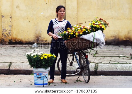 NAMDINH, VIETNAM - APRIL 13: Unidentified mangoes vendor at the mangoes small market on April 13, 2014 in Namdinh, Vietnam. This is a small market for retail mango and street vendors.
