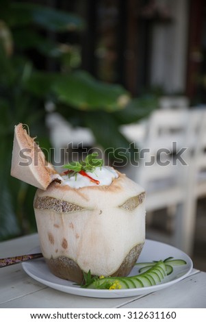 The tradition Thai steamed curry sea food in coconut.