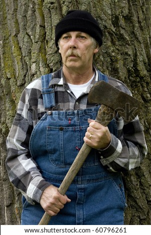 Portrait Of A Lumberjack Logger With Axe In Hand In Vertical Format ...